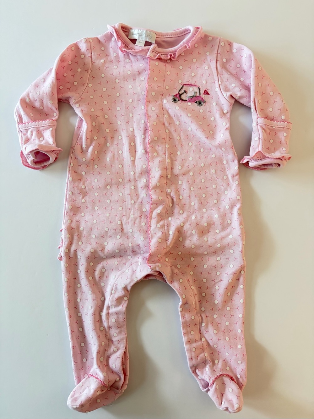 Magnolia baby pink footie with golf cart and golf ball print 3Mo